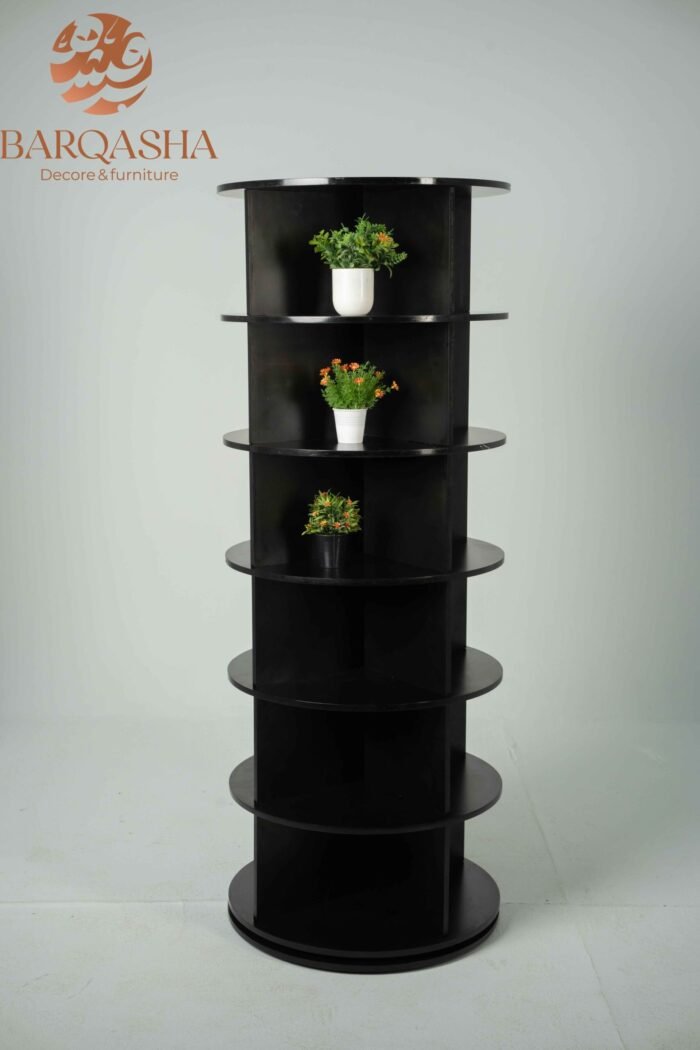 black rotatable shoe storage contains decorative plants with a white background and logo barqasha