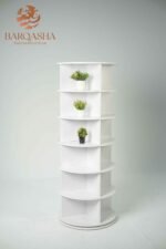 white rotatable shoe storage contains decorative plants with a white background and logo barqasha